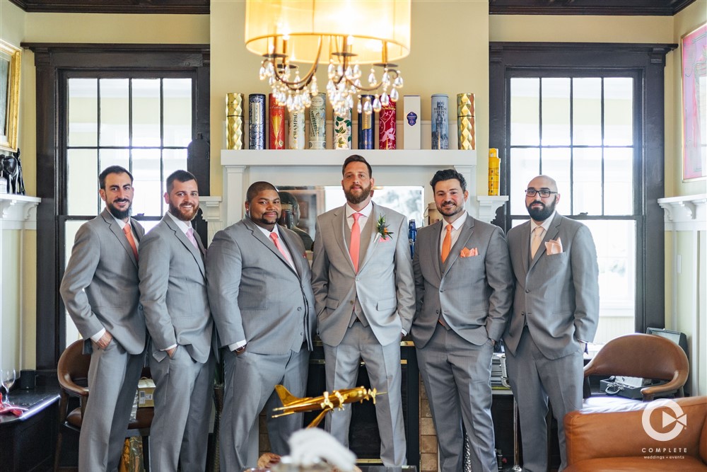 Groomsmen toast at the Palmetto Riverside B+B. Photography by Complete Weddings + Events Sarasota.