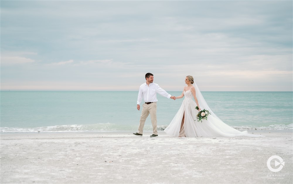 Longboat Key Club Resort beach wedding bride and groom portraits.