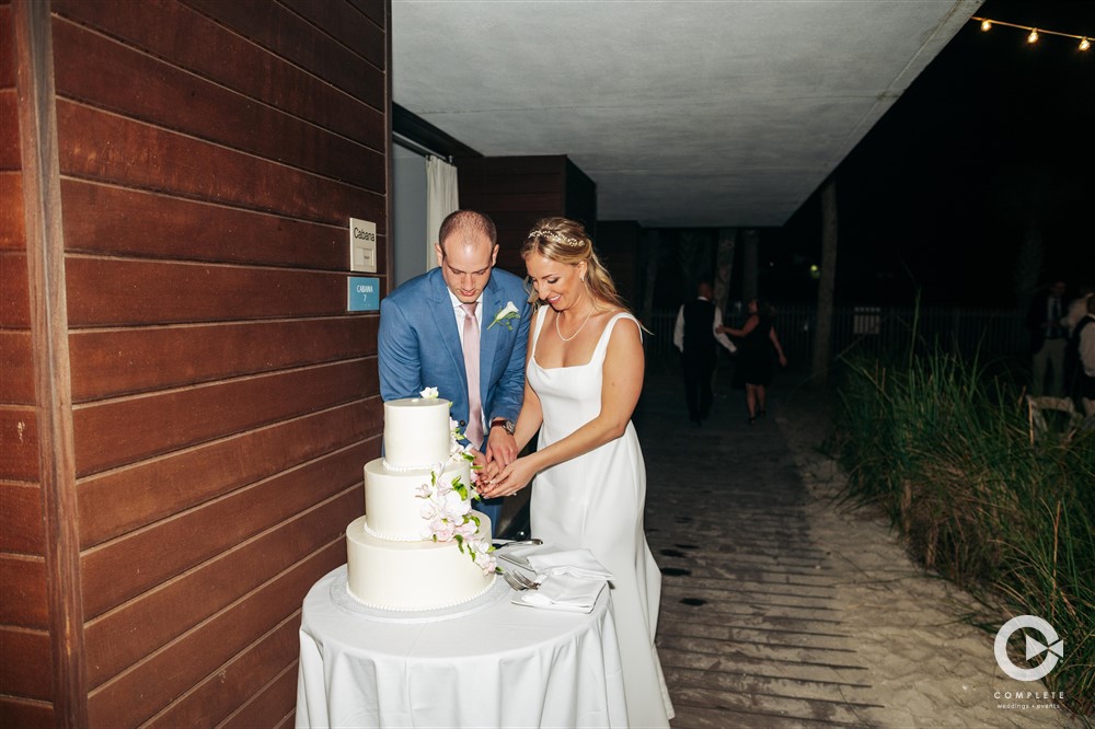 Zota Beach Resort wedding cake cutting. 